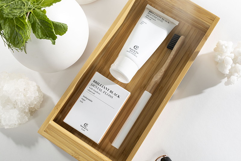 photo of biodegradable floss + organic vegan toothpaste