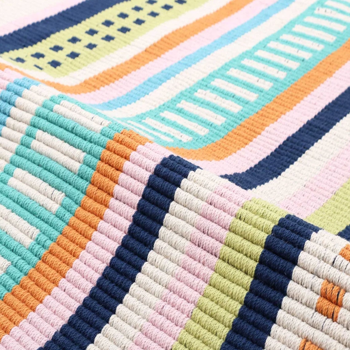 loomy colorful striped rug made with plastic bottles